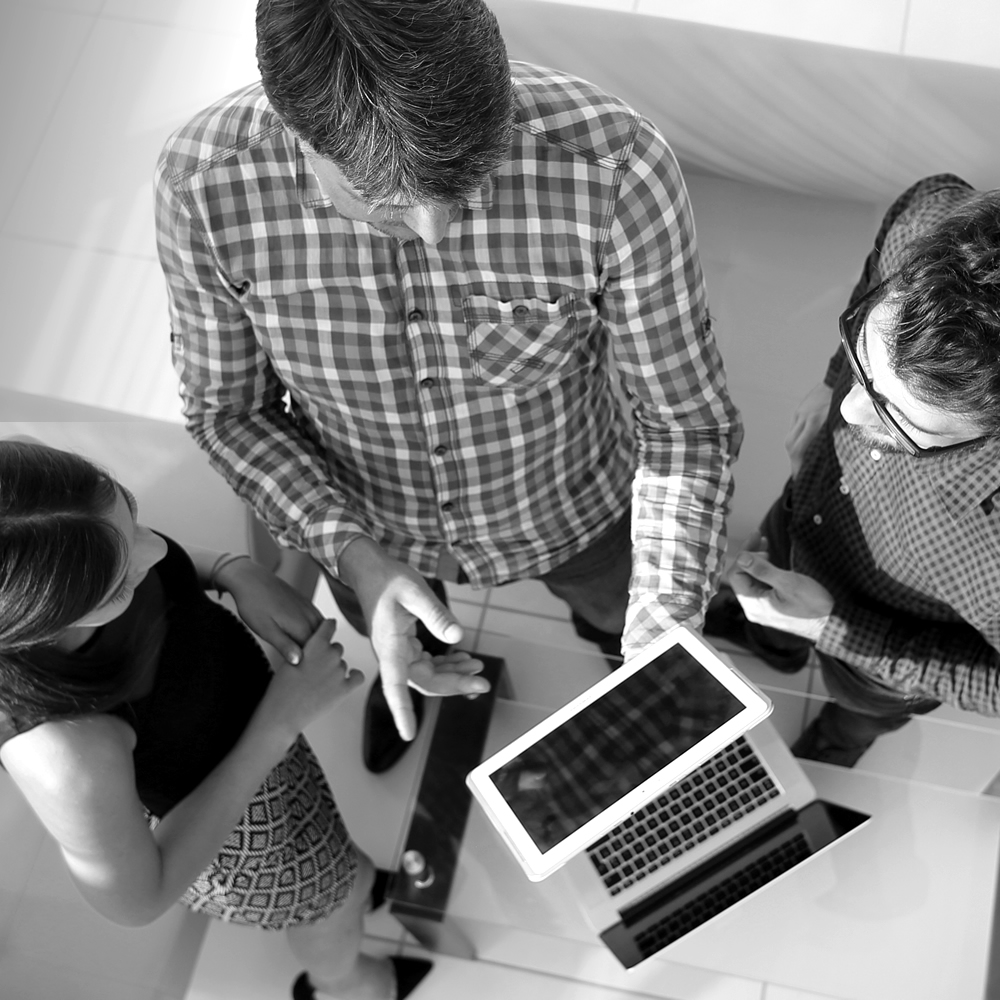 Photo of people sharing a tablet